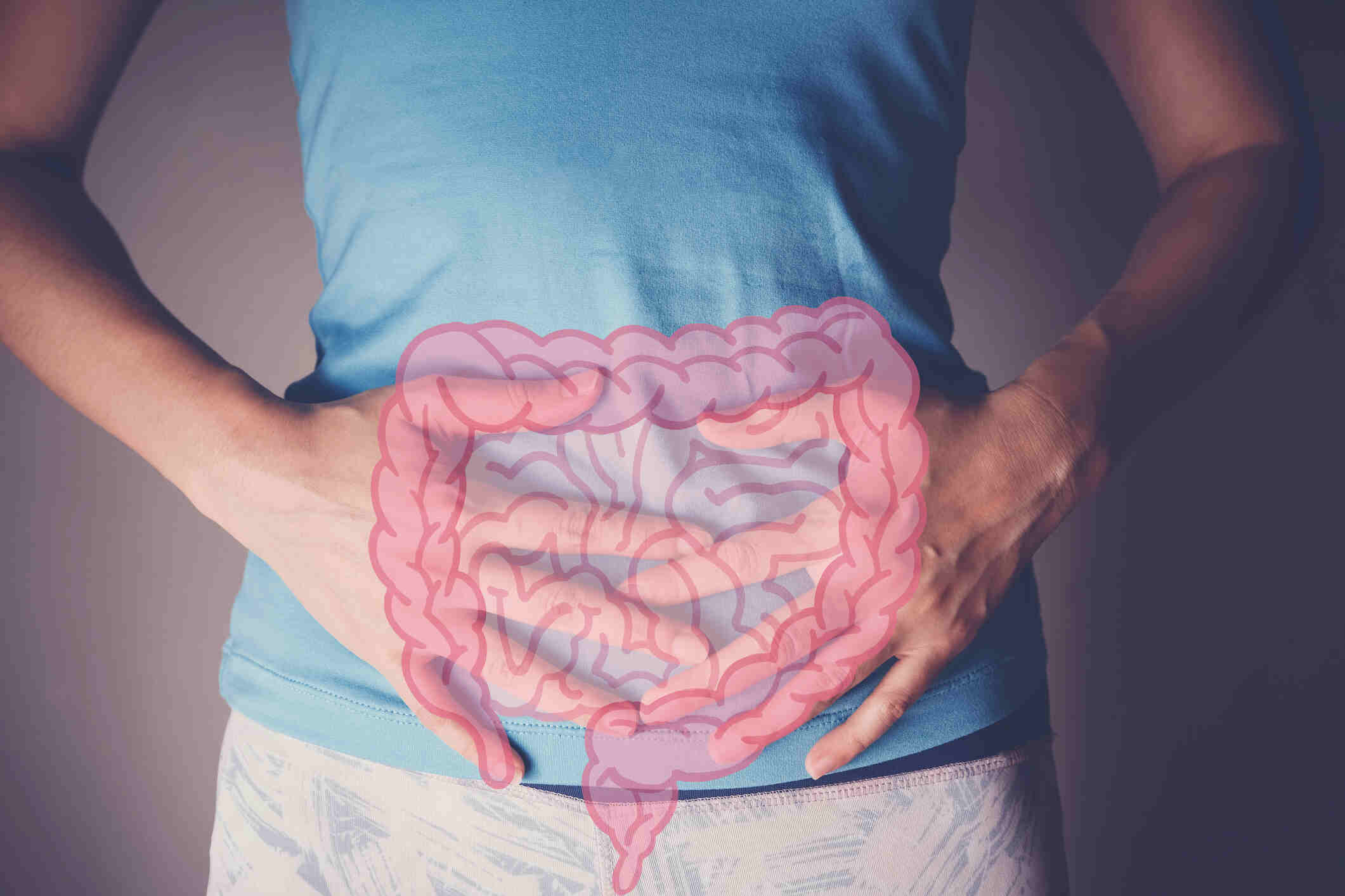 woman hands on her stomach with intesline, probiotics food for gut health, colon cancer, bowel inflammatory concept beverlysurgeoncolorectalhills